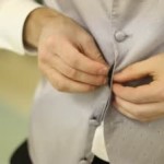 stock-footage-man-buttoning-up-tuxedo